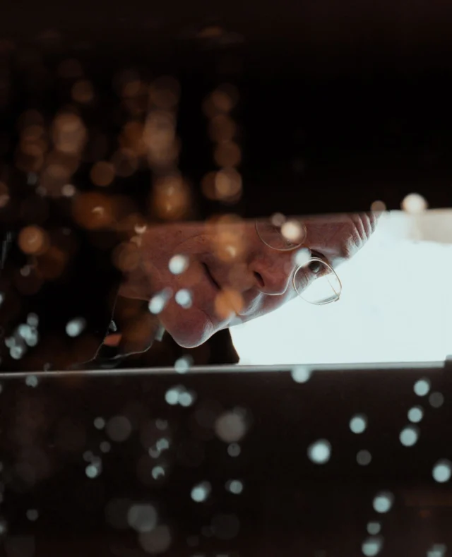 Tom keeping a close eye on the pressing process, making sure every drop of these red grapes is handled with care.
